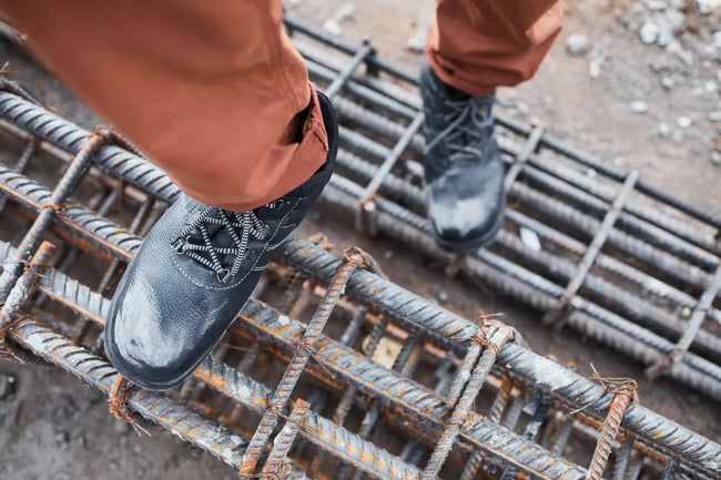 construction worker work in heavy duty safety work boots