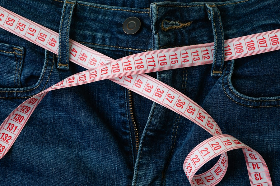 Men's pants with measuring tape.