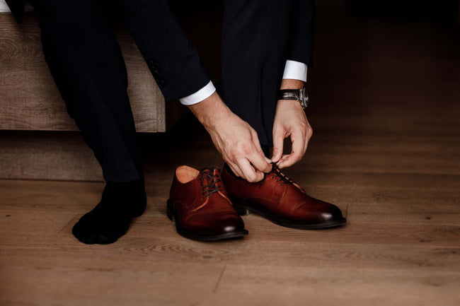 man wearing socks and classic elegant shoes