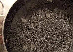 How does water boil in a pot without a lid?