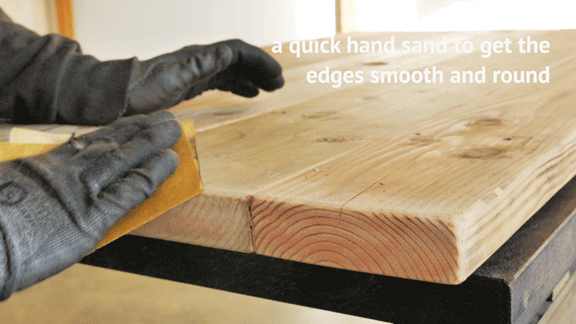 Sanding modern reclaimed wood furniture edges
