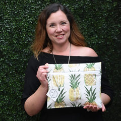 Eileen Zimmerman, Founder of Wander & Perch, with the Wear a Crown in Pineapple Wander Wet Bag™