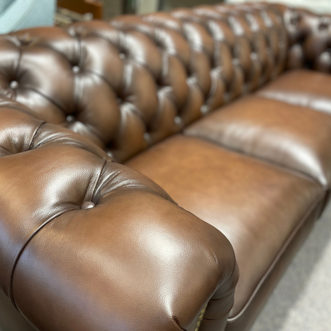 Kennedy Leather Sofa shown in Walnut featuring top grain leather and split hides