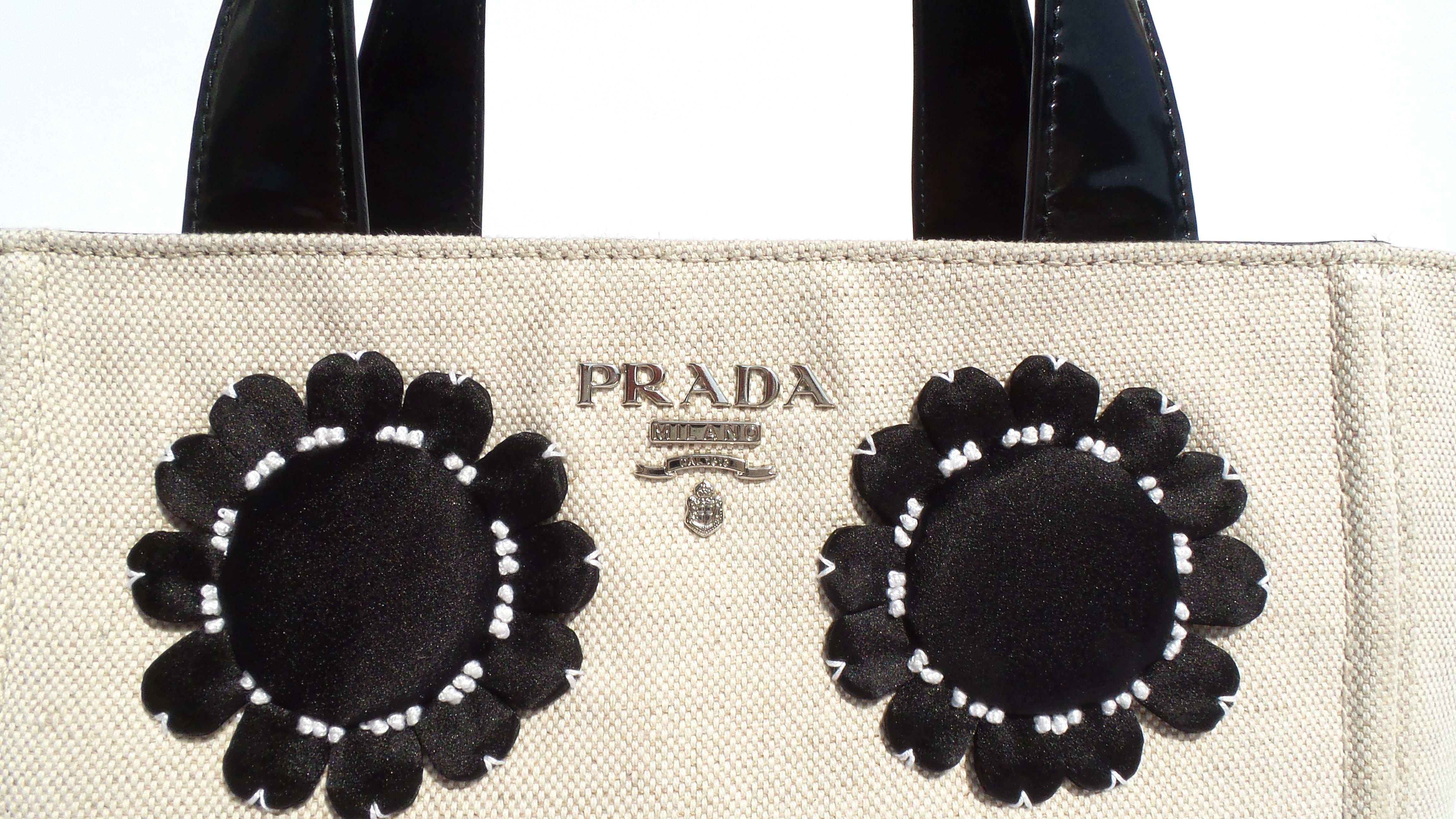 Sold' PRADA Mistolino Beige Canvas Black Patent Satin Floral Applique –  Encore 