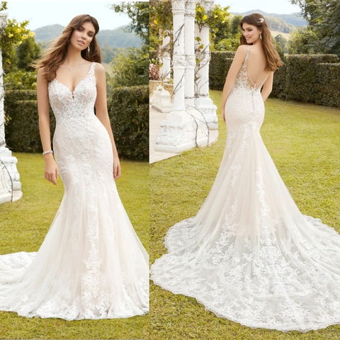 Mermaid wedding dress with long train  Luxe lace fit and flare bridal gown with beading.