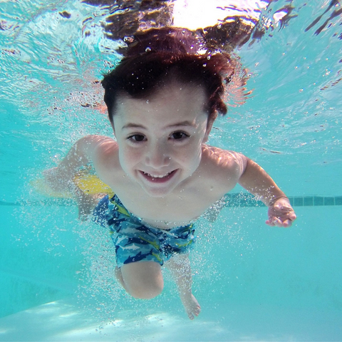 Young boy smiling underwater