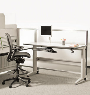 Modern office space with minimalistic desk and ergonomic computer chair.