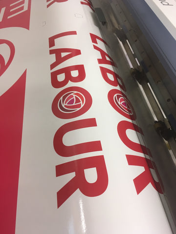 The podium graphic in production on Barrow Signs wide format printer
