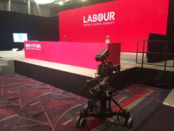 The stage set of the Labour Party conference showing the foam table wrap made by Barrow Signs