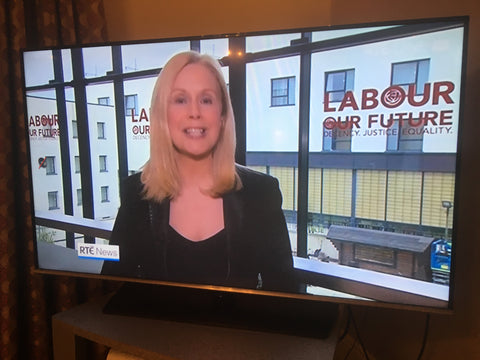 Screen Grab from RTE News showing window decals by barrow signs