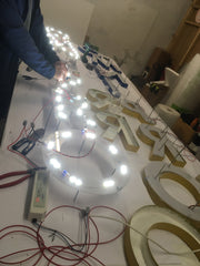 LED illuminated signage being assembled and bench tested at Barrow Signs