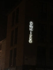 OmniPro signage at night on the northern elevation - installed by Barrow Signs