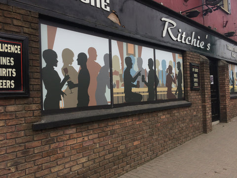 Aluminium panel covering damaged windows on derelict site