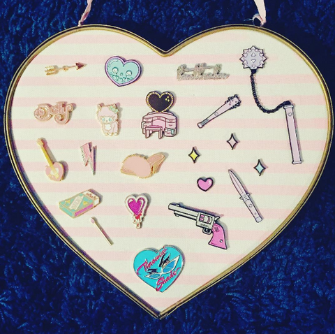 cute pin collection on heart cork board