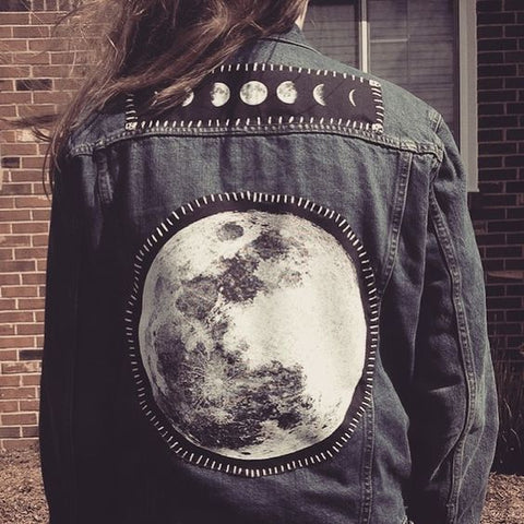 full moon patch on a denim jacket