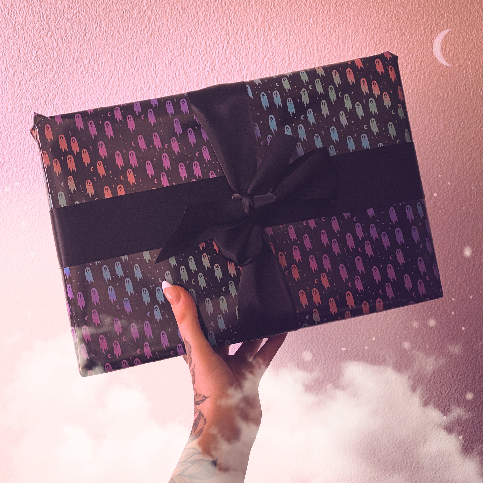 https://cdn.shopify.com/s/files/1/1110/8254/products/magical-rainbow-ghost-wrapping-paper-with-stars-and-moon_2000x2000.jpg?v=1637105950