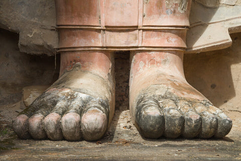 Feet of the Standing Buddha at Wat Mahathat in Sukhothai, Thailand.