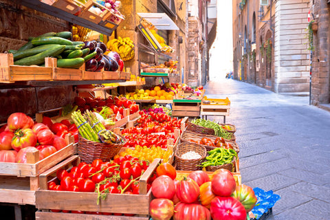 Fruit and vegetable market in narrow Florence street, Tuscany region of Ital