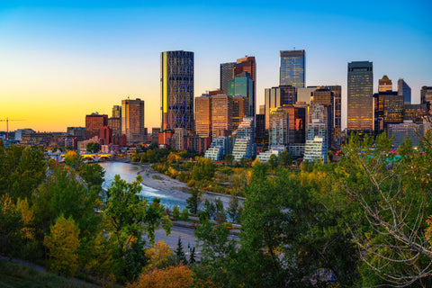 Sunset above city skyline of Calgary with Bow River, Alberta, Canada.