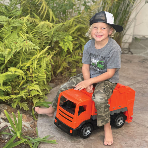 Ledge with his favorite Orange Garbage Truck