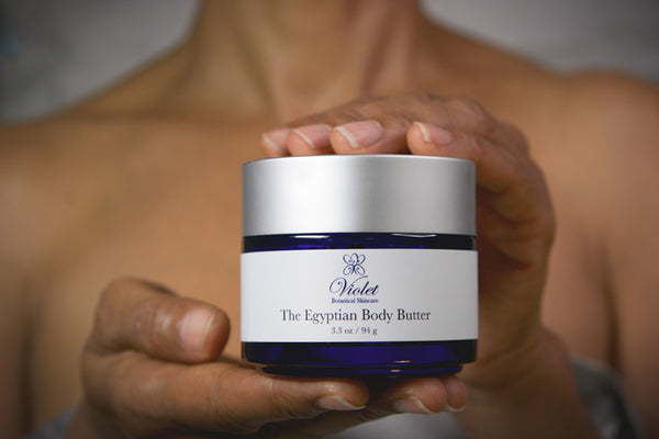 Hands holding Violet Botanical Skincare The Egyptian Body Butter