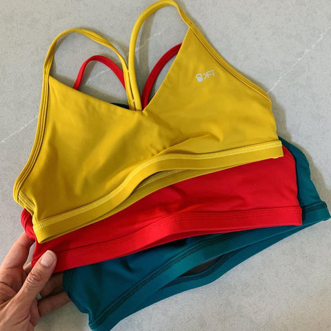 KFT Freedom Bra in Dijon, Brightest Red, and Teal Ocean