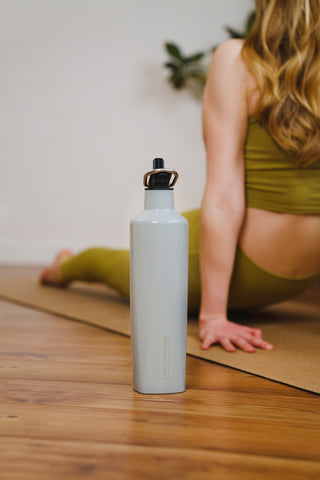water bottle sitting with yoga mat. 