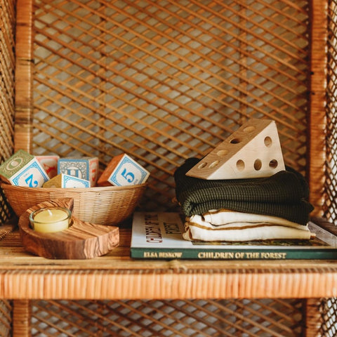 Wooden blocks and wooden lacing toy in a Waldorf toy collection