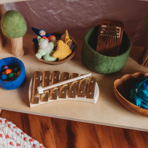 Pentatonic glockenspeil on a shelf with Waldorf toys and wooden toys