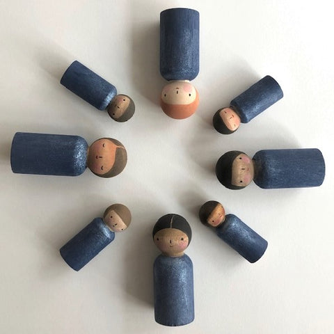 Peg dolls with hand painted blue bodies.