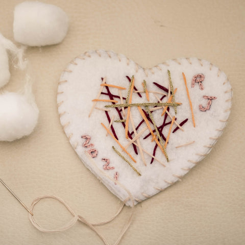 Embroidered felt heart garland. Kids DIY Valentine's crafts.