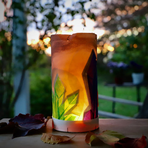 A handmade Martinmas lantern glowing in the twilight