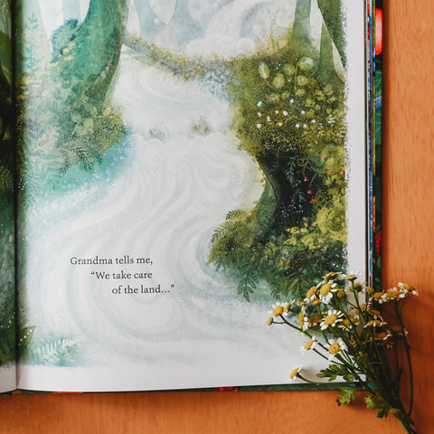 A picture book illustration opened with a bundle of small white flowers laying in the corner