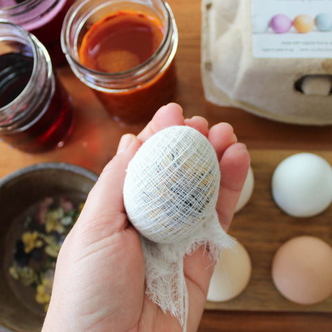 Cheesecloth wrapped around egg for a floral print egg dye with natural dyes.