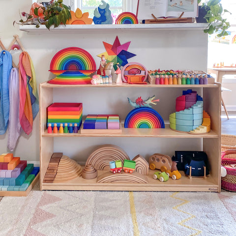 toy shelf with grimm's wooden toys and open ended building blocks