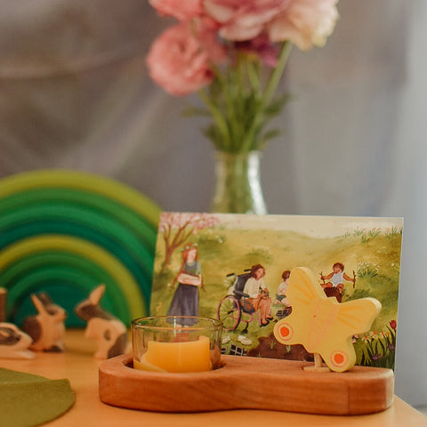 waldorf postcards holder with butterfly in front of ostheimer bunnies and flowers