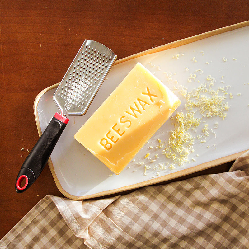 Shaved beeswax sits on a tray.