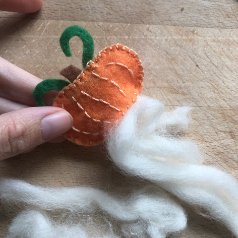 A tuft of sheep's wool sticking out of a pumpkin Fairy Hat