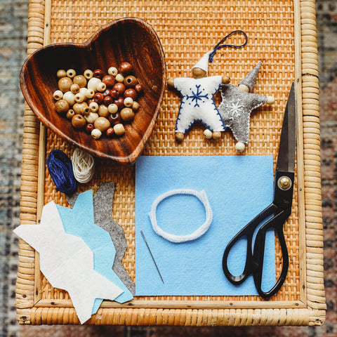 Felt, beads, and other materials to craft felt waldorf snowflake children