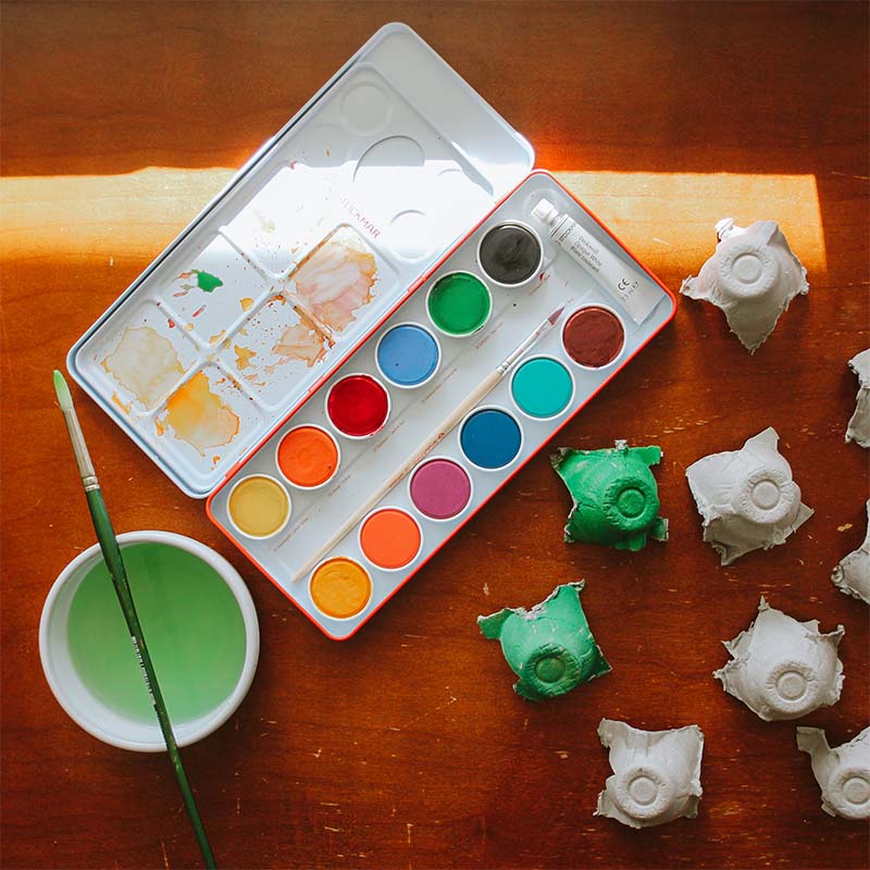 A Stockmar watercolor palette sits on a table.