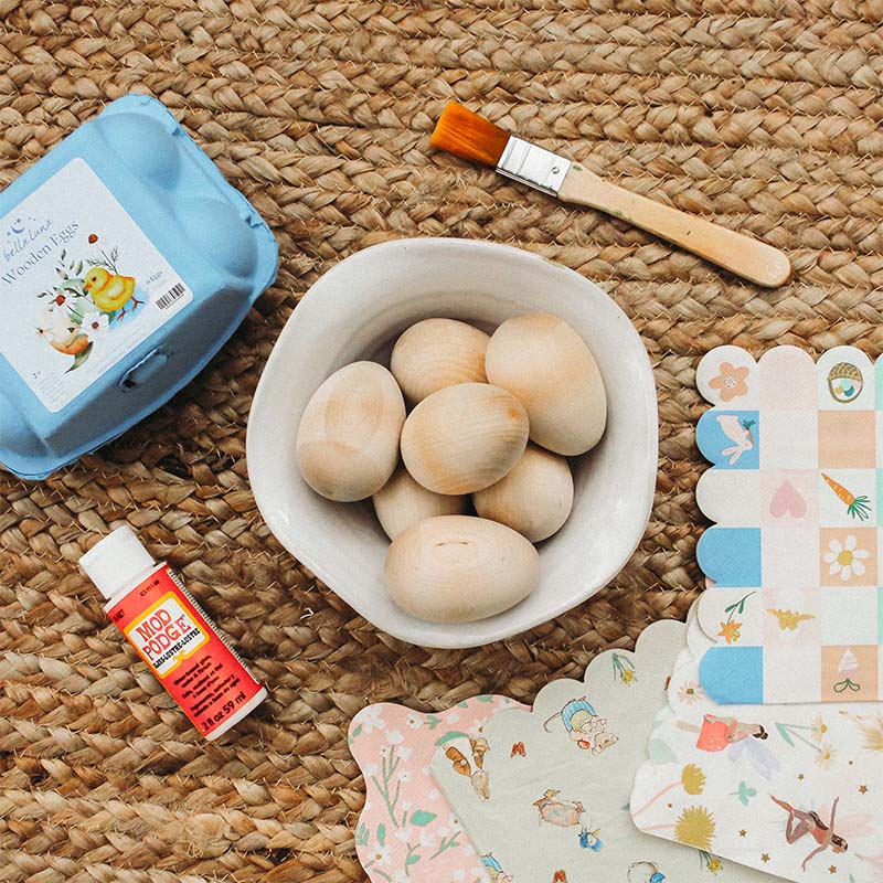 A collection of craft supplies sit on a rug.