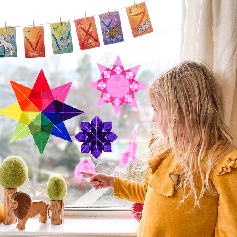 A window is filled with Waldorf Window Stars.
