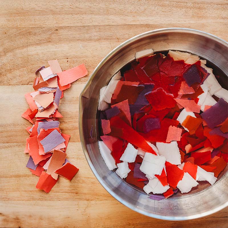 Scraps of paper are sitting in a bowl.
