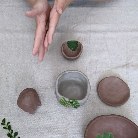 A child making pinch pots with clay DIY tutorial