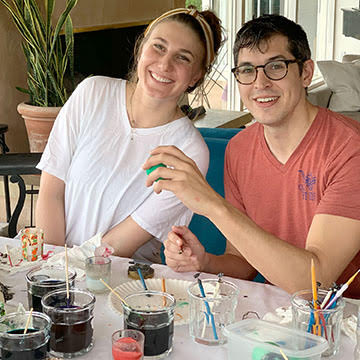 Margaret and her fiancé with their pysanky work area set up | Bella Luna Toys