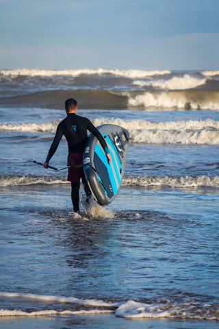 man standup paddleboard surfing