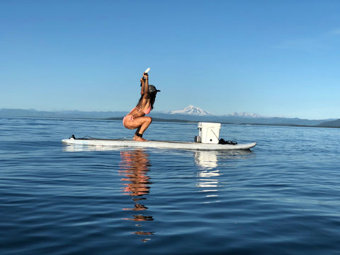 girl exercising on paddleboard