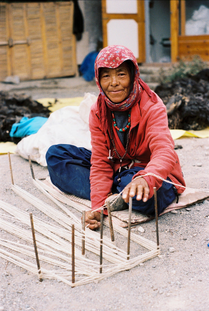 Backstrap loom weaving in Ladakh. Handwoven Woolen Carpets.