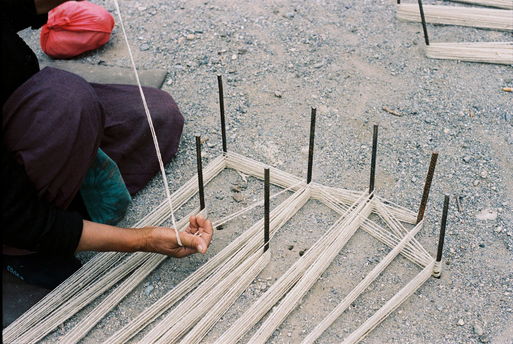 Backstrap loom weaving in Ladakh. Handwoven Woolen Carpets.