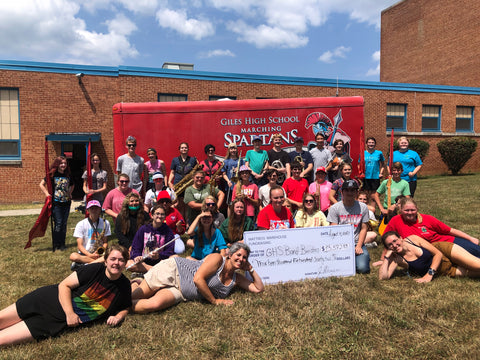 Giles High School Marching Band with donation check from Mattress Warehouse Fundraising